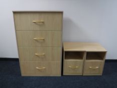 A contemporary beech four drawer chest together with a pair of matching bedside stands fitted a
