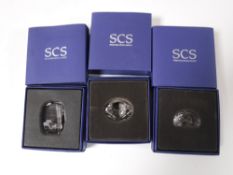 Two boxed Swarovski Crystal paperweights and a Swarovski Crystal prism