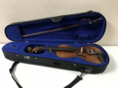 A 20th century child's violin and bow in case