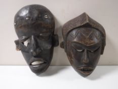 Two carved African tribal masks
