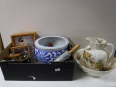 Two boxes containing blue and white planter, dolls in display cases, kitchenalia, glassware,