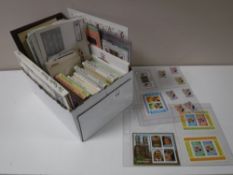 A box of assorted stamps - royalty etc, a wild life America smiler sheet,