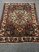 An antique Persian Bakhtiari rug 190 cm x 165 cm