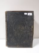 A leather bound family Bible containing colour lithographic plates