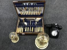 An oak canteen of cutlery, two anniversary clocks under shade and retro style telephone.