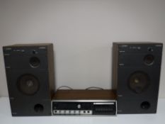 A Sharp Solid State stereo cassette deck and a pair of Wharfedale Mach 3 speakers