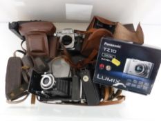 A Zeiss Ikon folding camera Novar Anastigmat 105mm together with other vintage cameras by Iflord,