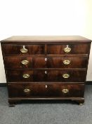 A George III mahogany five drawer chest on bracket feet,