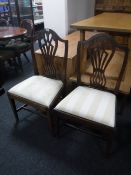 A pair of antique dining chairs