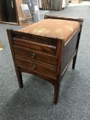 An Edwardian piano stool fitted two drawers
