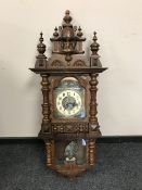 A 19th century oak cased wall clock with glazed panel