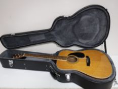 A Marlin acoustic guitar in hard carry case