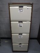 Two Bisley four drawer metal filing cabinets with keys