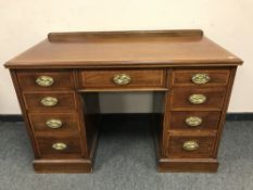 A Victorian inlaid mahogany pedestal desk, width 123 cm.