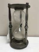 A silver plated hour glass, height 23.5cm.