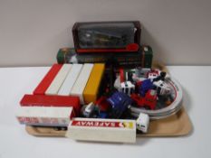 A tray of unboxed Corgi lorries with trailers, Eddie Stobart collector's plates,