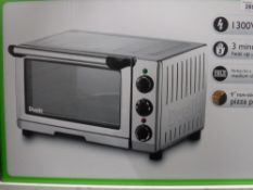 A boxed Dualit 18 litre mini table oven