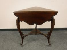 A Victorian occasional table with flap sided triangular top