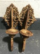 A pair of cast iron garden wall sconces