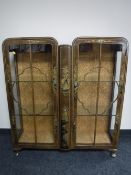 A mid 20th century chinoiserie walnut double door display cabinet