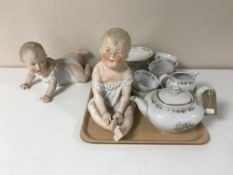 Two continental bisque figures of babies together with a Bavarian tea service CONDITION