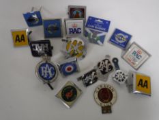 A tray of mid 20th century and later car badges including Volvo, RAC, AA,