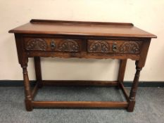 An Old Charm two drawer oak side table,
