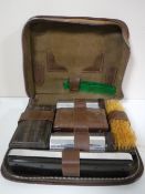 An early 20th century leather cased six piece gents travel set with an eclipse razor