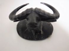 A Black Forest style carved buffalo head