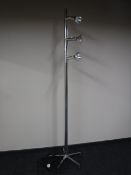 A three lamp track light on five way stand