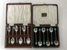 A set of six cased silver plated Art Deco teaspoons and another set of six teaspoons
