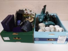 Two boxes of assorted china and metal ware including commemorative mugs, wall plates,