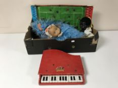 A mid 20th century Chad Valley tin plate soccer stadium together with a Pixiano and two dolls