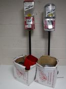 Two coin operated dispensers on stands together with two boxes containing parts