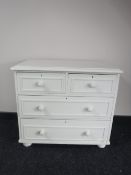 A painted pine four drawer chest