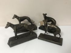 Two pairs of cast metal figures of grey hounds