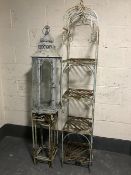 A large hurricane lamp together with a nest of two metal plant stands and a metal four tier whatnot