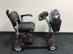A TGA Eclipse electric disability cart with accessory bag,