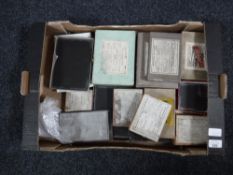 A box containing antique photographic negatives CONDITION REPORT: These are all