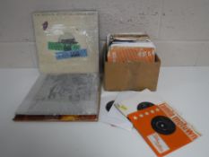 A tray containing a small quantity of LP's and 45's including The Beatles,