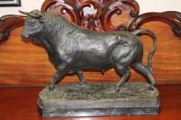 A most impressive bronze statue of a bull, on marble base, width 63cm.