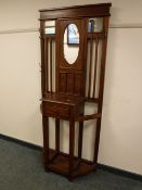 A reproduction mahogany mirrored hall stand