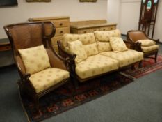 An oriental style three piece lounge suite, comprising of high backed armchair,