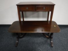 An inlaid mahogany side table fitted two drawers together with a mahogany coffee table