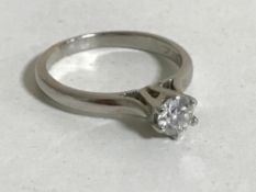 An 18ct white gold solitaire diamond ring