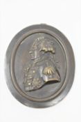 A 19th century bronze plaque depicting an admiral,