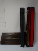 An oak Riley snooker scoreboard together with a two piece snooker cue in hard case and a pot black