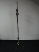 A brass adjustable standard lamp