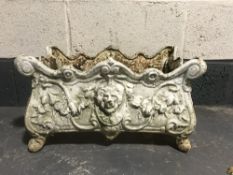 A 20th century cast iron Louis XV style lion mask planter