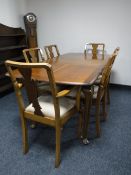 An eight piece walnut Queen Anne dining room suite